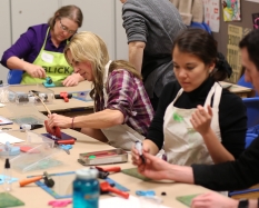 Participants create a work of art during a Maker Night event. Photography by Rob Strong.
