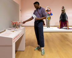 A Dartmouth student explores an interactive touch display in the galleries.