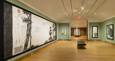 A museum gallery installed with giant works on paper created by a contemporary ink and brush Korean artist.