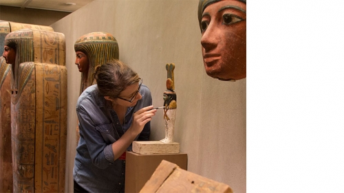 Conservator Anna Serotta '03 examines an object from the Egyptian Art collection at The Metropolitan Museum of Art