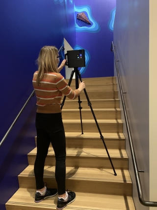 Digital Content Manager Alison Palizzolo captures Courtney Leonard's site specific installation in the stairway with the 3D camera. Photo by Jami Powell.