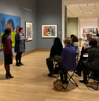 Curator of Academic Programming Amelia Kahl introduces Hood Museum Intern Victoria McCraven during her "A Spoce for Dialogue" gallery talk. Photo by Alison Palizzolo.