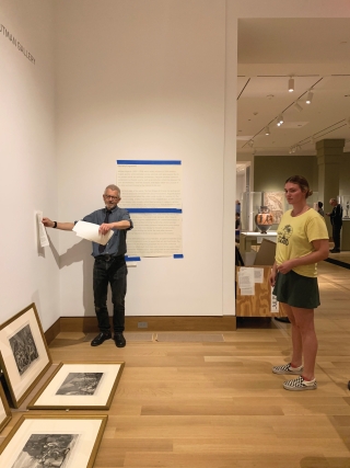 2018-19 Levinson Intern Jules Wheaton installing her A Space for Dialogue exhibition Society Engraved with Head of Exhibitions Design and Planning Patrick Dunfey. Photo by Alison Palizzolo.