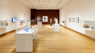 A museum gallery installation of traditional and contemporary Native American ceramic art.