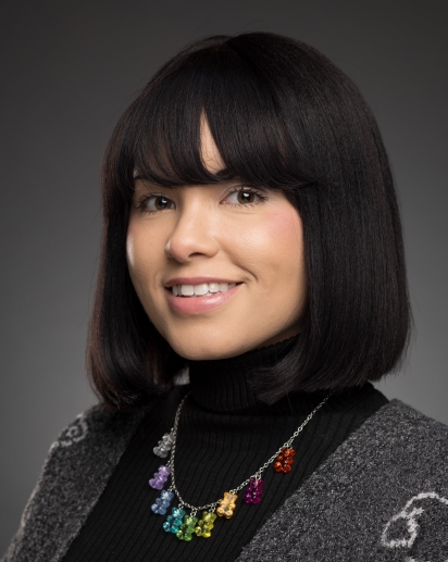 A headshot of Candace Griffith. A young woman with dark hair. 