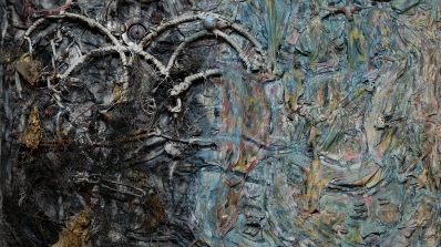 A sculptural 3D painting that employs cloth, paint, and various found objects.
