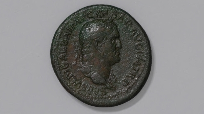 An ancient coin, depicting the profile bust of a ma.