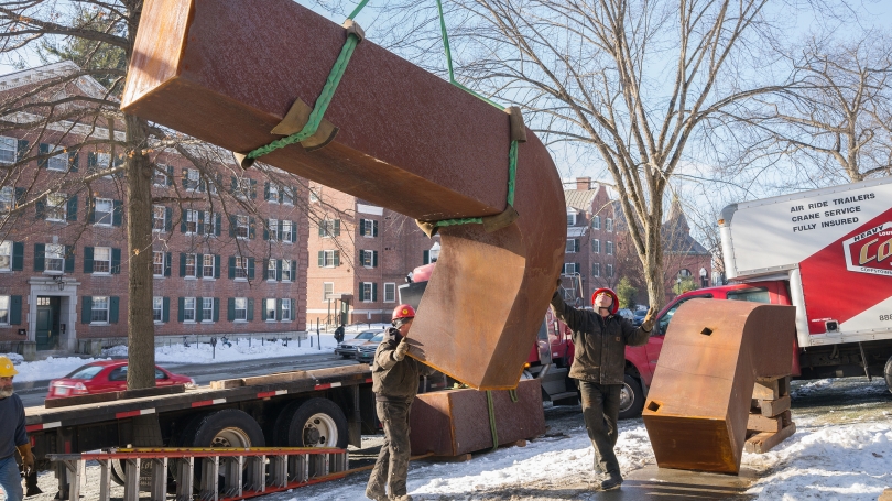 Workmen install Clement Meadmore's sculpture "Perdido" near the corner of Wheelock Street and Observatory Road.