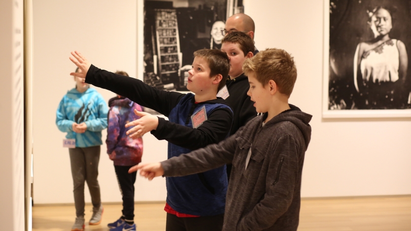 A fifth grade Images class from White River School explores and discusses CIPX: Dartmouth with Kali Spitzer and Will Wilson for their "Artist as Experimenter" lesson. Photo by Rob Strong.