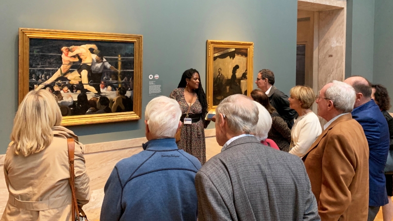 Members of the Director's Circle engaging in a learning to look exercise with Key Jo Lee, Assistant Director of Academic Outreach, at the Cleveland Museum of Art. 
