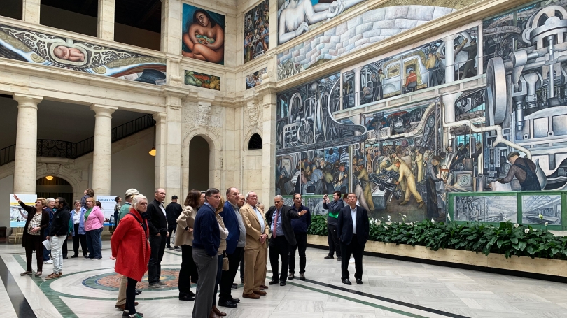 Director's Circle members viewing the Detroit Industry Murals by Diego Rivera while on a private tour of the Detroit Institute of Arts.