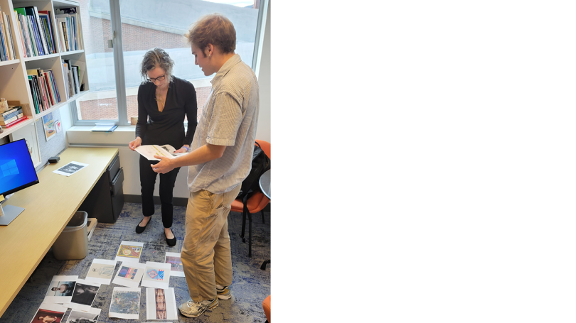 Colin Donnelly '24, Class of 1954 Intern (right), looks over options for his A Space for Dialogue exhibition with his supervisor Neely McNulty. 