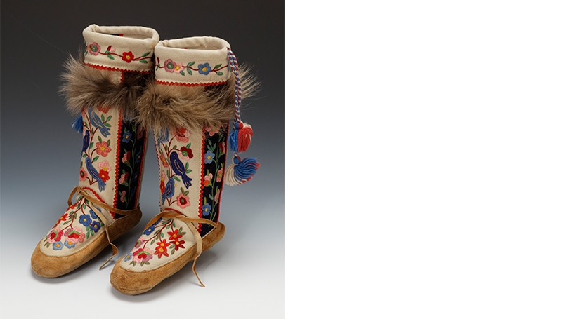 Mukluks made by a Dene (Athabascan) artist, about 1940, tanned and smoked moose hide, duffle, embroidery thread, wolf fur (added at a later date), yarn, thread.