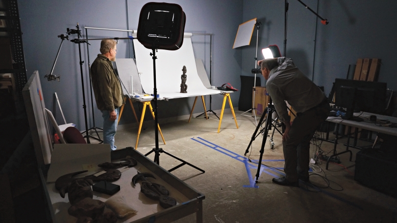 John Reynolds, lead preparator, and photographer Jeffrey Nintzel photographing three-dimensional African art objects from the Hood’s permanent collection. Photo by Alison Palizzolo.