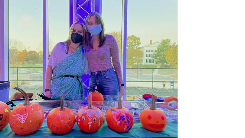  Programming Interns Emily Charland '19, Erbe Intern, and Amy Zaretsky '23, Conroy Intern, put on a fall pumpkin-decorating program in 2022.