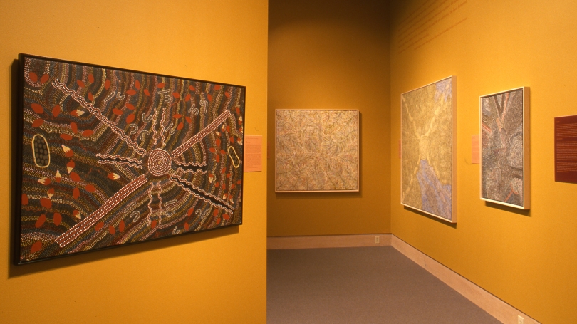 A museum installation of Indigenous Australian art.