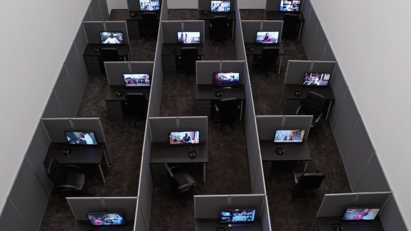 Kader Attia, Reason's Oxymorons, 2015, 18 films and installation of cubicles, duration: variable, 13 to 25 minutes, 55 x 262 x 468 inches (installed overall), Edition of 3. Photo: Max Yawney. Courtesy the Artist and Lehmann Maupin, New York and Hong Kong.