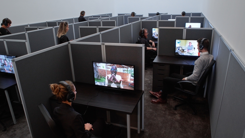 Kader Attia, Reason's Oxymorons, 2015, 18 films and installation of cubicles, duration: variable, 13 to 25 minutes, 55 x 262 x 468 inches (installed overall), Edition of 3. Photo: Max Yawney. Courtesy the Artist and Lehmann Maupin, New York and Hong Kong.