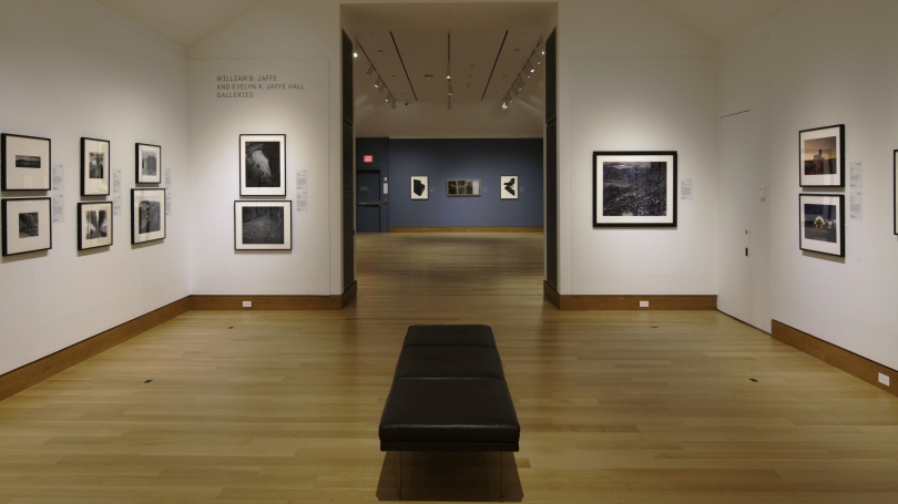 A museum gallery of landscape photography and a second gallery beyond with contemporary Japanese prints.