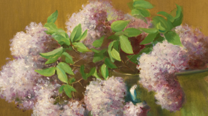 A close up of "Lilacs." There are purple painted lilacs visible bound together in a bouquet. 