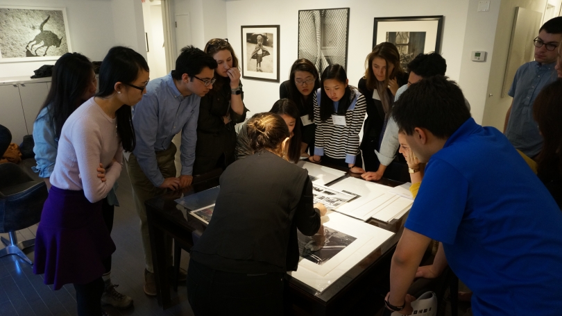Students from the 2016 spring Museum Collecting 101 session review potential photographs in NYC for the museum to acquire. Photo by Amelia Kahl.