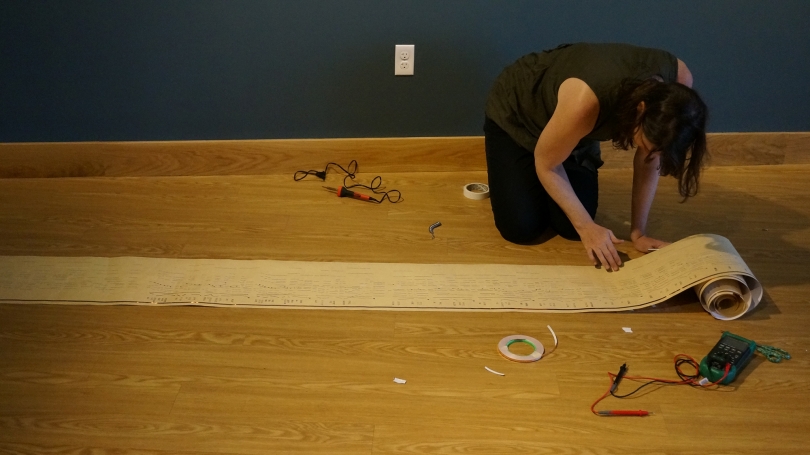 Jess Rowland prepares the piano roll that makes up Life This In Find We.