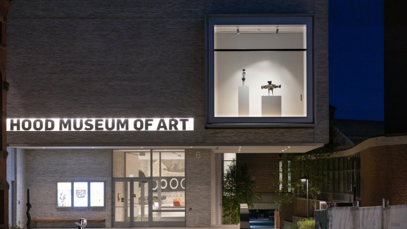 Two bronze sculptures installed in the Hood Museum's vitrine window.