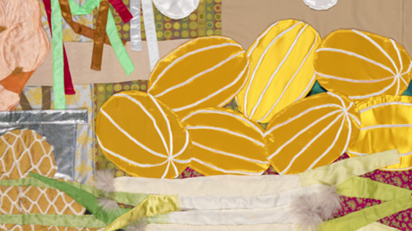 A close up of "Shijang: ChungGwaMul." Yellow asian pears are visible and woven into the quilt.