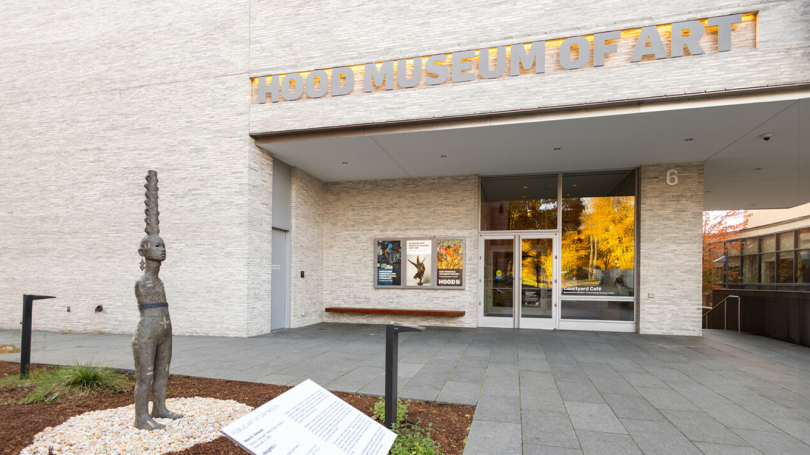 A view of the Hood Museum of Art's facade. On the right is a sculpture by Rose B. Simpson. 