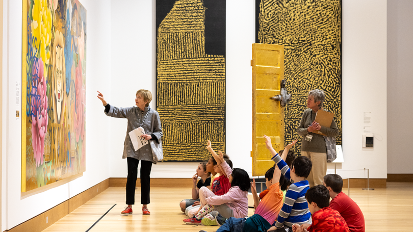 Elementary school students discuss "Gilded: Contemporary Artists Explore Value and Worth."