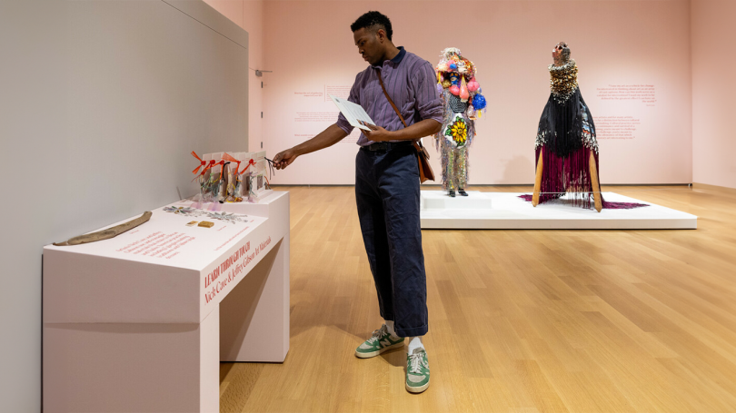 A Dartmouth student explores an interactive touch display in the galleries.