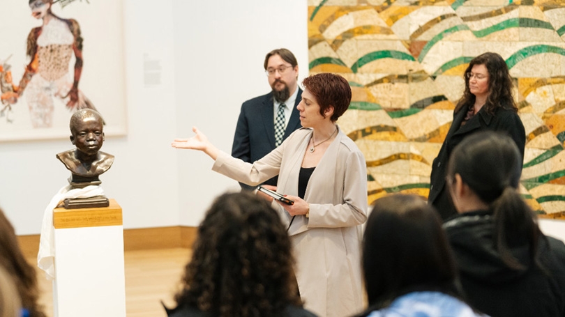 Juliette Bianco '94, deputy director of the Hood Museum of Art, gives a tour of the new galleries after the Hood reopened earlier this year. 