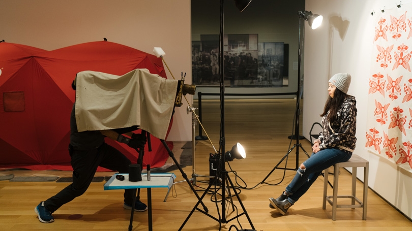Photographer Will Wilson makes a tintype portrait of Gabe Canfield '21 as part of an exhibit at the Hood Museum of Art. 