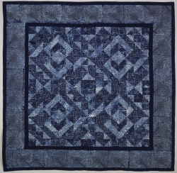 A quilt made of indigo (blue) dyed fabrics.
